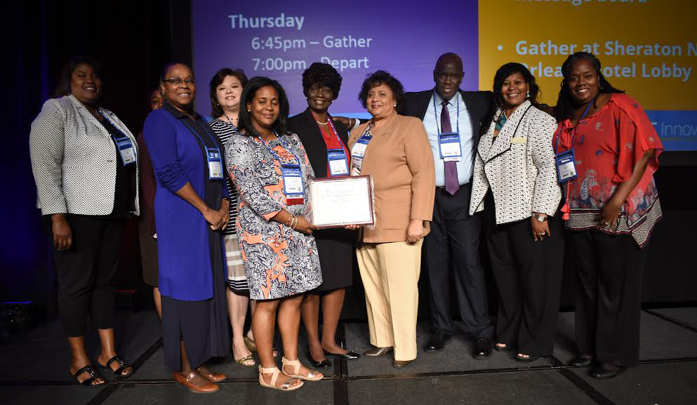 Group from SU system recieving award from MERLOT