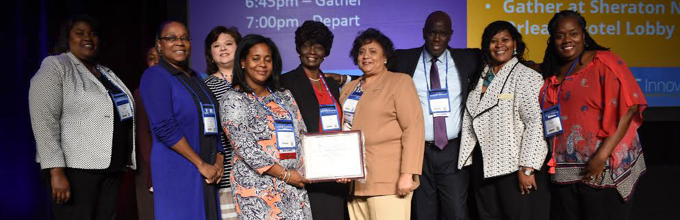 Group from SU system recieving award from MERLOT